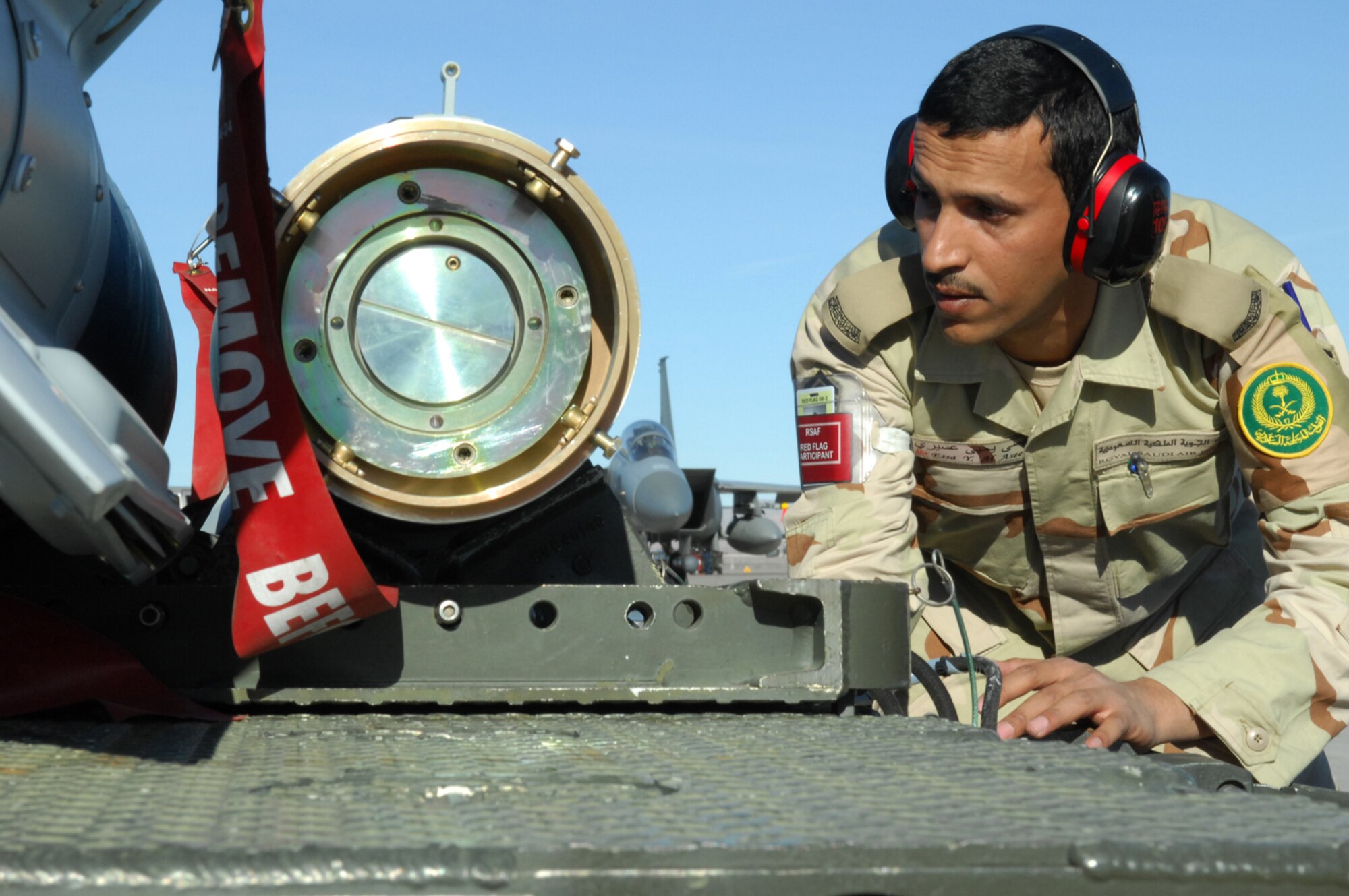 NELLIS AIR FORCE BASE, Nev.—Sgt. Essa Y. Al Asseri, a weapons maintainer with the 6th Squadron, Royal Saudi air force, inspects a bomb before loading onto a Saudi F-15S during Red Flag here Feb. 12. Red Flag is a multi-national exercise providing pilots with a realistic environment to practice combat scenarios. The experience gained during the exercise is vital to the survival of pilots in combat. (U.S. Air Force photo by Staff Sgt. Taylor Worley)