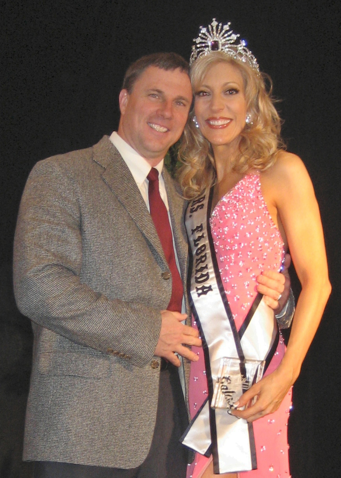 EGLIN AIR FORCE BASE, Fla -- Melissa Behnke, was named Mrs. Florida Galaxy 2008, Feb. 3. She’s the wife of Lt. Col. Thomas "Hog" Behnke, 53d Test Support Squadron commander. Mrs. Behnke competed against 20 other delegates at the Florida Galaxy Pageant based on community service, interview with a panel of judges, swim suit (fitness), high fashion runway modeling, and evening gown. The Mrs. Florida title spotlights Mrs. Behnke's platform and the organizations she works with as a volunteer. Her platform, *"H.E.A.L. our Children," creates awareness about the health crisis our children are facing in this country and how to go about improving their health and preventing disease, thru nutrition and exercise The couple also earned the title of "Florida's Perfect Couple 2008" at the Florida United States contest last year. (Courtesy photo)