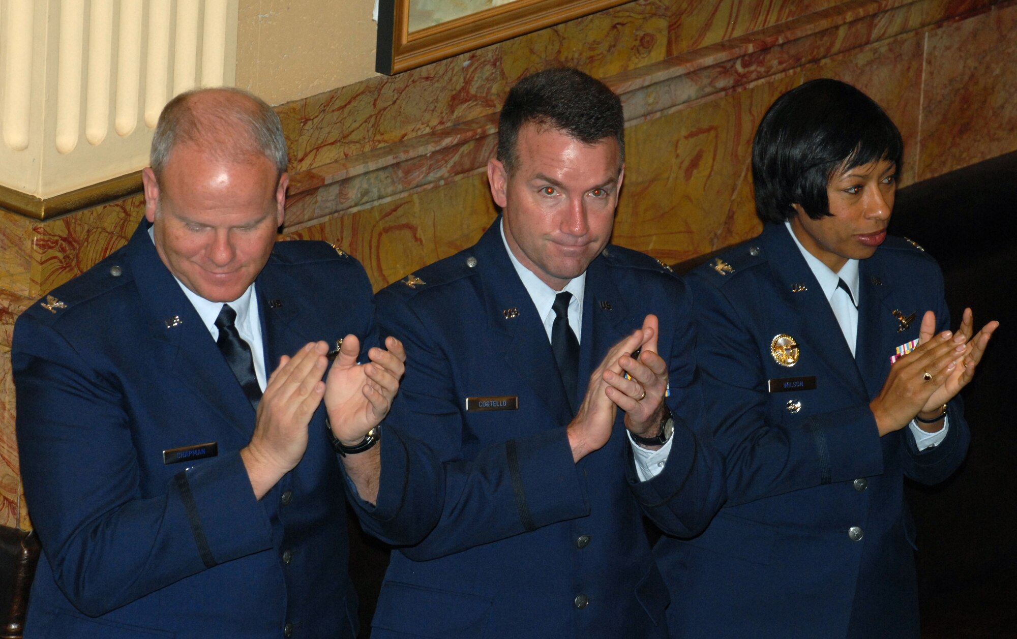 Colonel Burton Chapman(left), Commander, 302nd Air Wing, Peterson Air Force Base, Colo., Colonel Gerald Costello(center), Vice Commander, Headquarters Air Reserve Personnel Center and Colonel Charlotte Wilson(right), Vice Commander, 460th Space Wing, Buckley Air Force Base, Colo. show their support and appreciation after the Colorado State House of Representatives adopted Proclamation 10-07 proclaiming Feb 13, 2008 Military Appreciation Day in Denver, Colo., Feb 13, 2008.  (U.S. Air Force photo by Airman First Class Randi Flaugh)