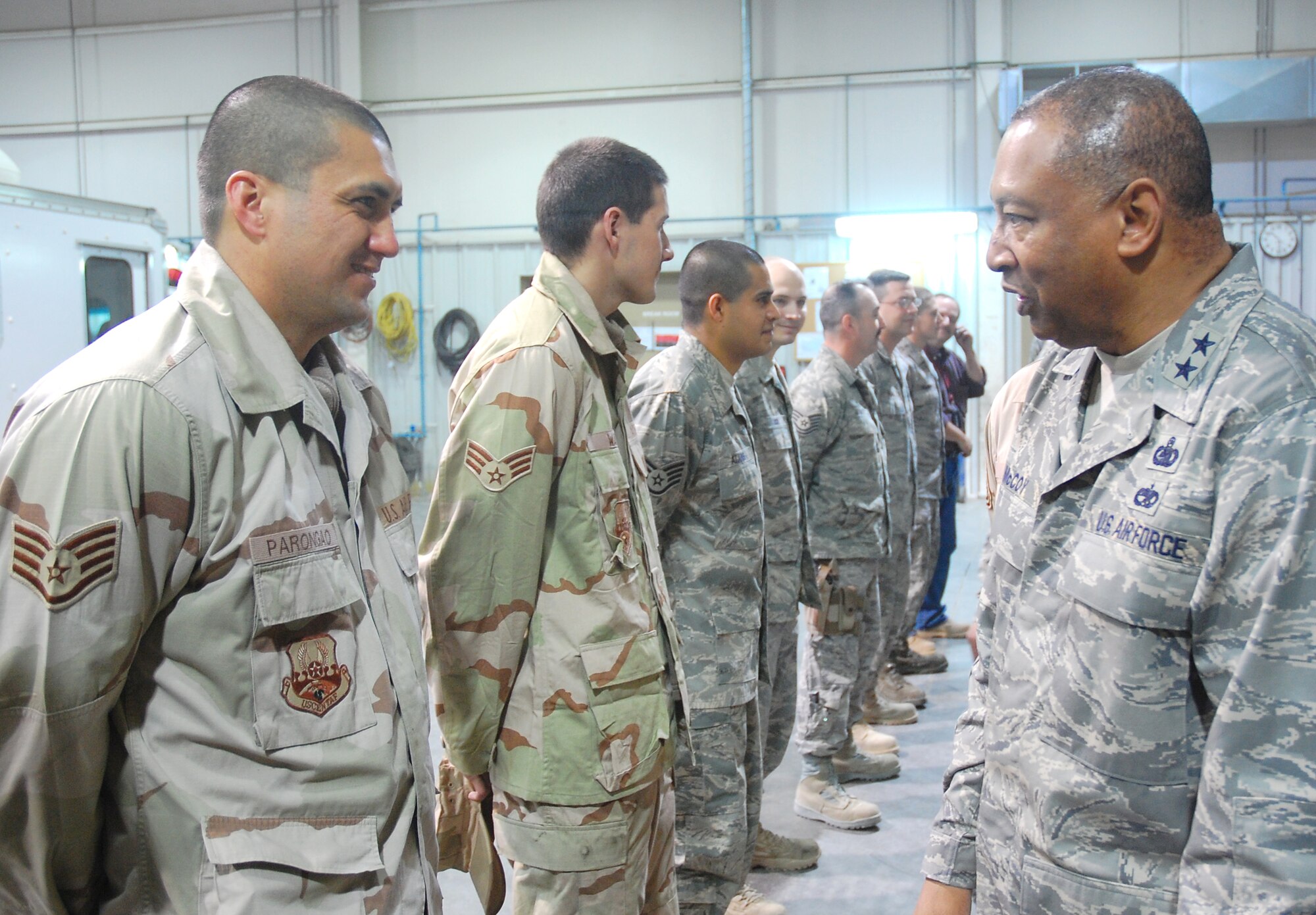 Major Gen. Gary T. McCoy, Director of Logistics Readiness, Office of the Deputy Chief of Staff for Logistics, talks with Staff Sgt. Brandon Parongao during his visit to an air base in Southwest Asia Feb. 16, 2008. Sergeant Parongao works at the vehicle maintenance facility as part of the 386th Air Expeditionary Logistics Readiness Squadron and is deployed from Spangdahlem Air Base, Germany.  The general's visit was the last stop on a tour of five bases in the Central Command area of operations. (U.S. Air Force photo/Capt. Jason McCree)