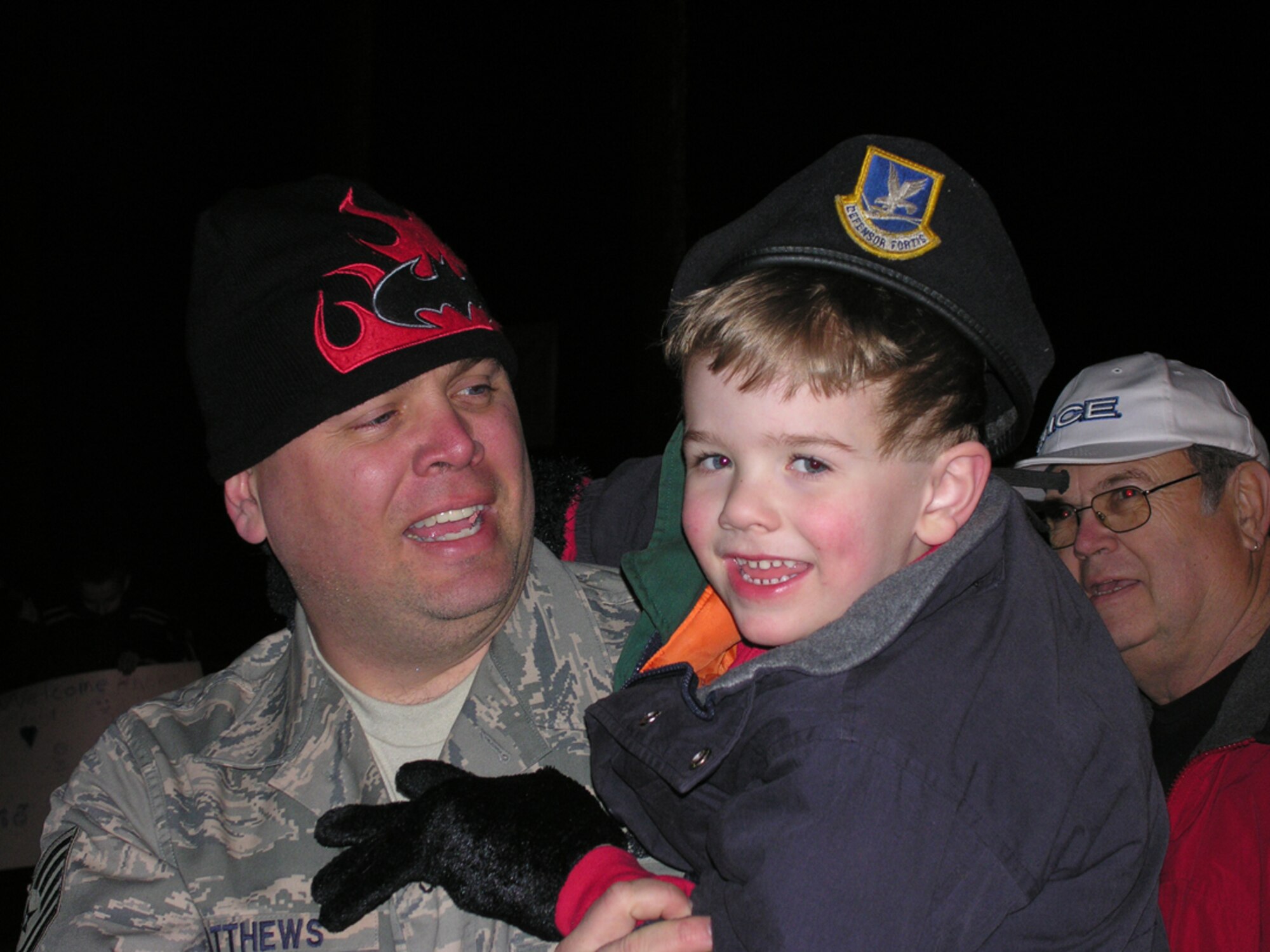 SEYMOUR JOHNSON AIR FORCE BASE, N.C. -- Tech. Sgt. Patrick Matthews swaps hats with his son upon returning from a six-month deployment to Iraq. More than 30 916th Security Forces reservists returned home of Valentine's Day. U.S. Air Force photo/Capt. Shannon Mann