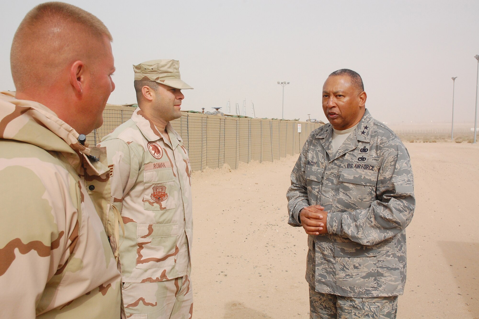 Major Gen. Gary T. McCoy, Director of Logistics Readiness, Office of the Deputy Chief of Staff for Logistics, visits with Staff Sgt. Jimmy Roman (right) and Technical Sgt. Dennis Wallace at a Southwest Asia air base Feb. 16, 2008. Sergeant Roman is deployed from Pope Air Force Base, S.C. and Sergeant Wallace is deployed from McGuire AFB, N.J. and work at the 386th Air Expeditionary Logistics Readiness Squadron fuels facility. The general's visit was the last stop on a tour of five bases in the Central Command area of operations. (U.S. Air Force photo/Capt. Jason McCree)