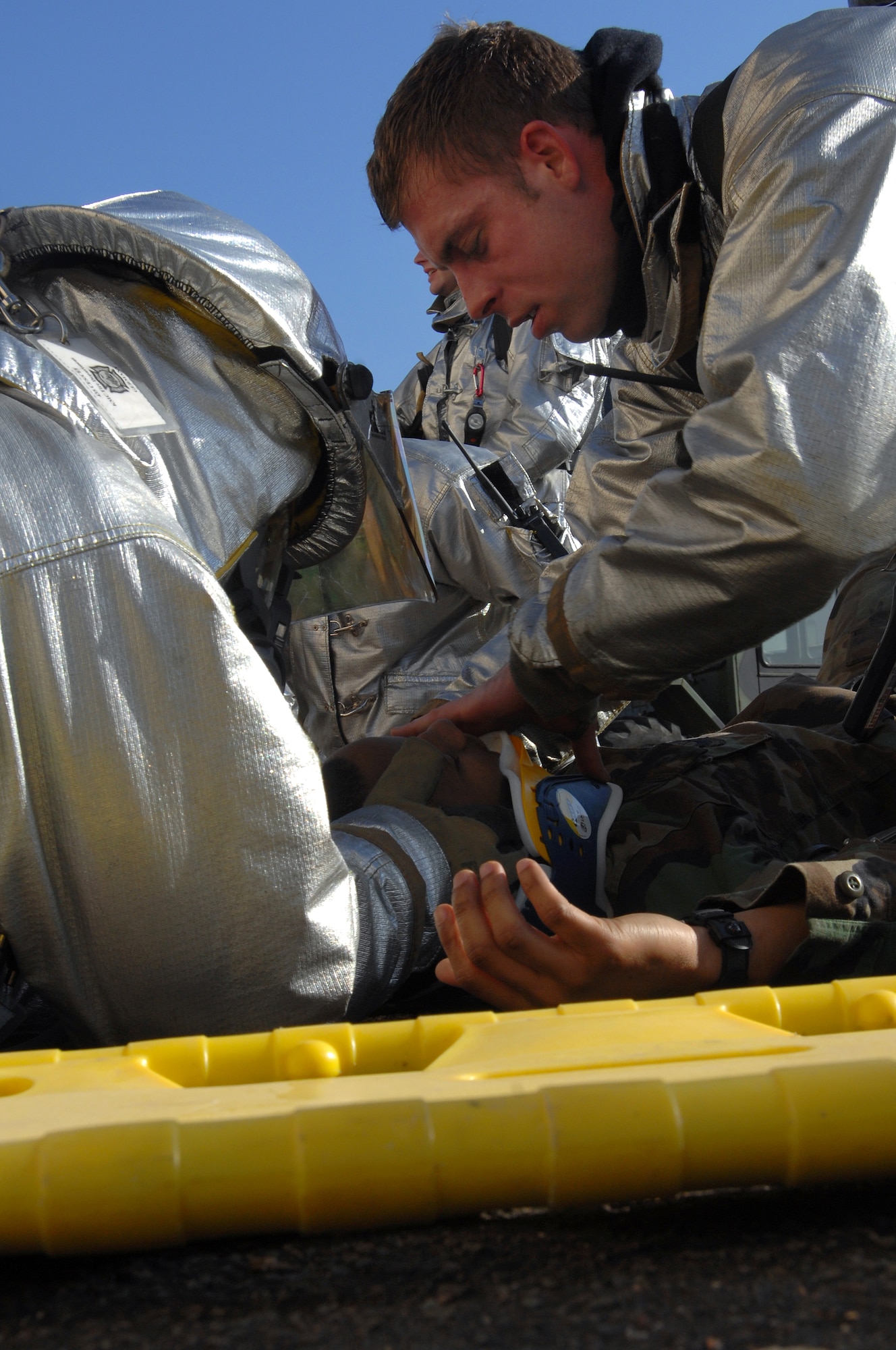 More than 20 Ramstein firefighters participate in a mass casualty exercise Feb. 11 here. The scenario involved victims trapped in a burning building. Photo by Airman 1st Class Kenny Holston