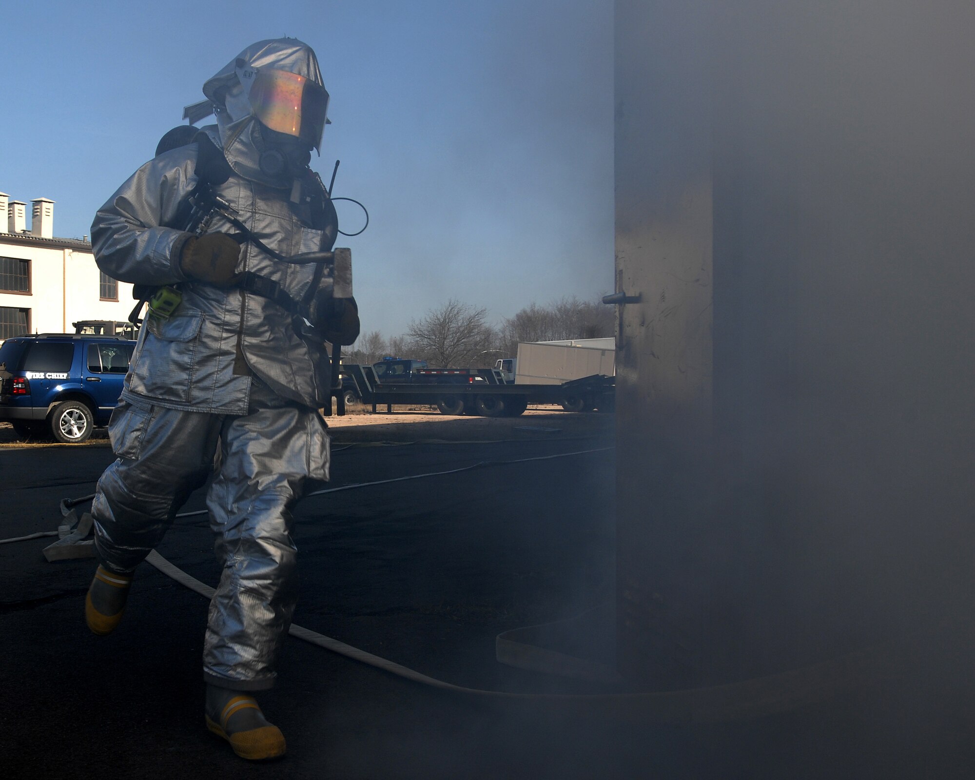 More than 20 Ramstein firefighters participate in a mass casualty exercise Feb. 11 here. The scenario involved victims trapped in a burning building. Photo by Airman 1st Class Kenny Holston