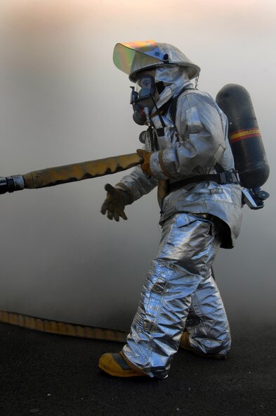 More than 20 Ramstein firefighters participate in a mass casualty exercise Feb. 11 here. The scenario involved victims trapped in a burning building. Photo by Airman 1st Class Kenny Holston