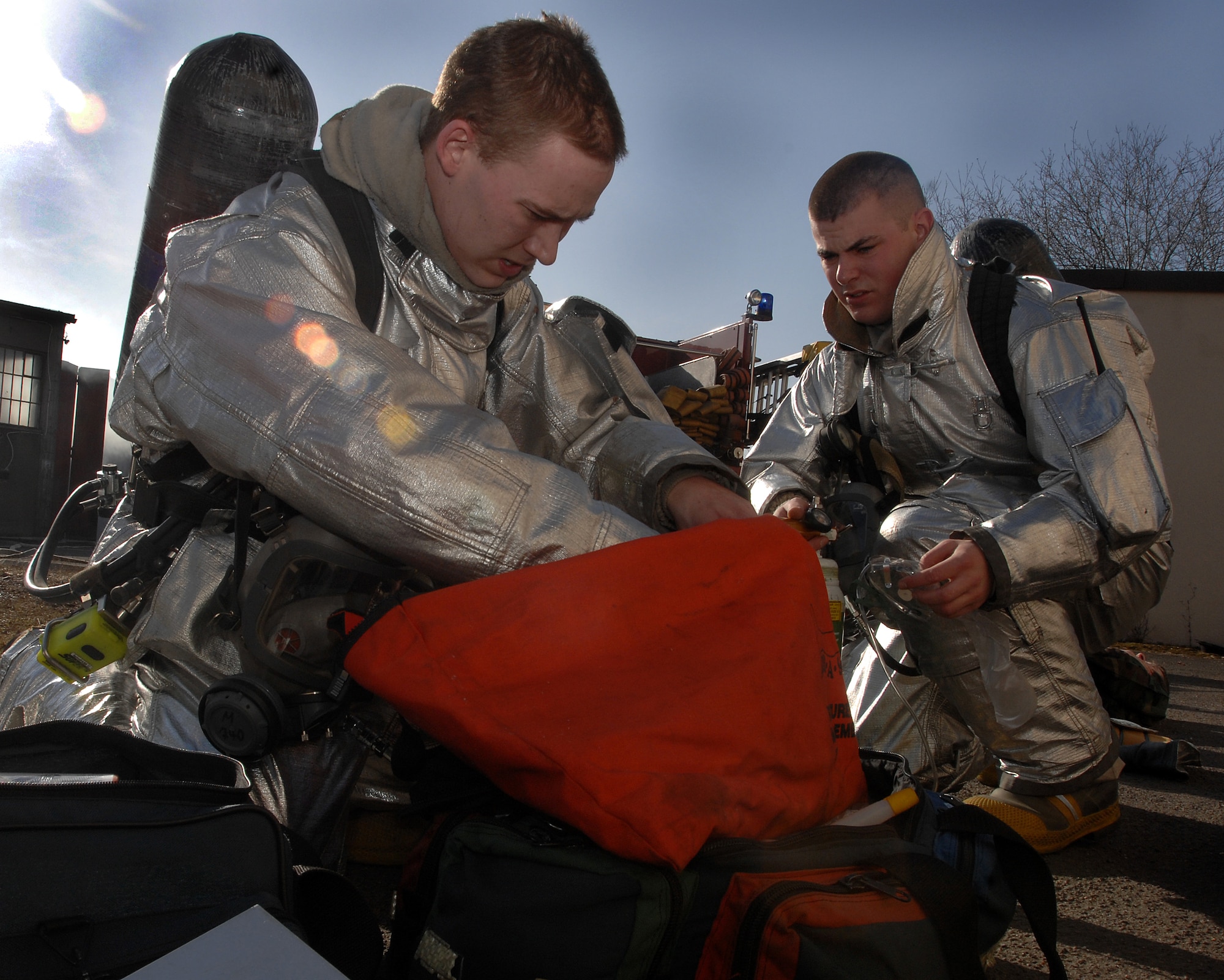 More than 20 Ramstein firefighters participate in a mass casualty exercise Feb. 11 here. The scenario involved victims trapped in a burning building. Photo by Airman 1st Class Kenny Holston