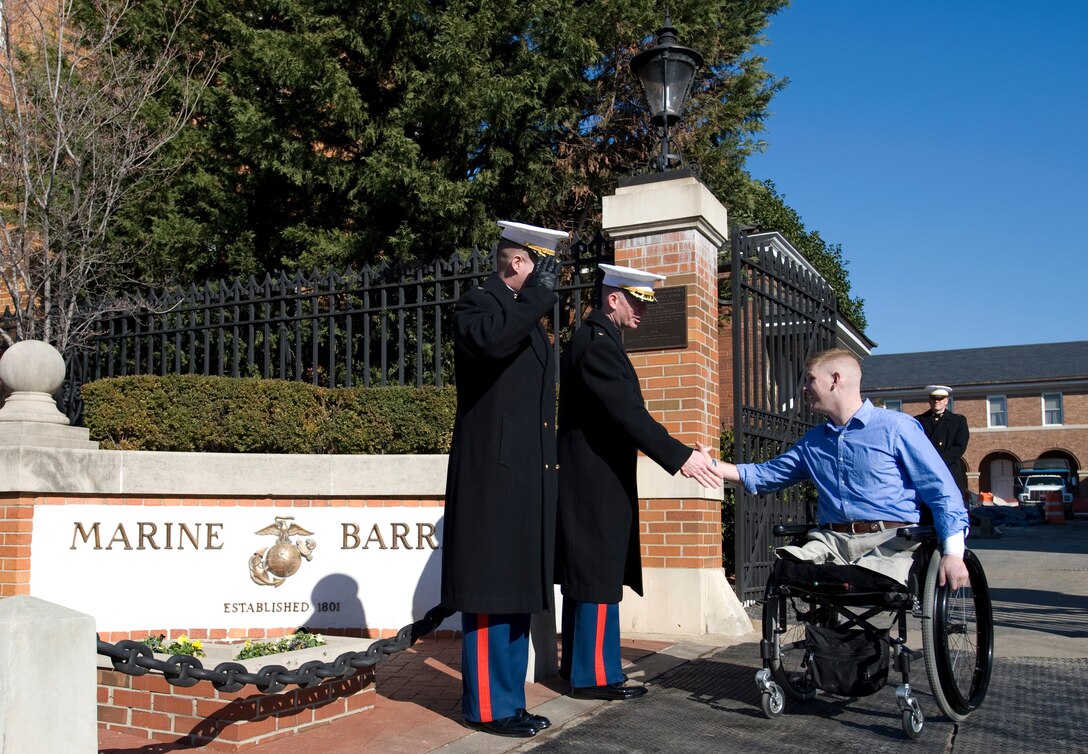 U.S. Marine Corps Majs. Mike Castellano and Brad Weston bid farewell to Marine Lt. Andrew Kinard as he departs a Valentine's Day luncheon, Washington, Feb. 16, 2008. The luncheon, hosted by retired U.S. Marine Gen. Peter Pace and his wife, Lynne, and supported by the USO, honored wounded warriors and their families. 
