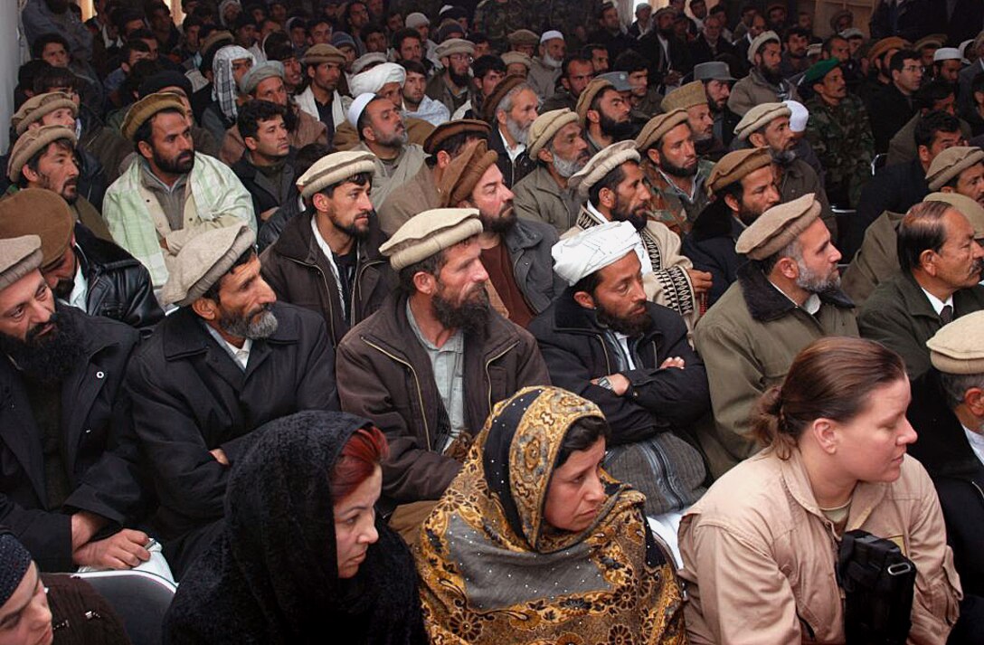 Local leaders listen to the governor of Kapisa Province in eastern Afghanistan at a recruiting conference, Feb. 16. 