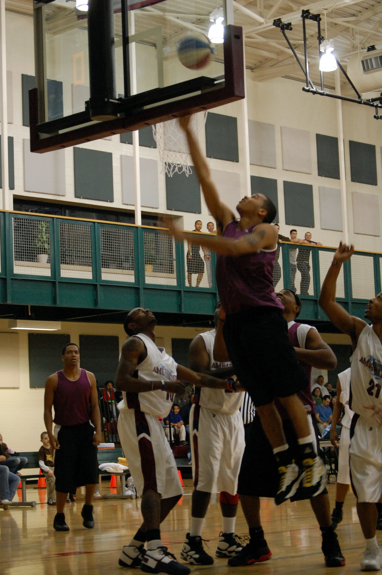 LAUGHLIN AIR FORCE BASE, Texas – Airman 1st Class Luke Smith, 47th Operations Support Squadron, makes two points during a basketball game played against the world-famous Harlem Ambassadors at the Losano Fitness Center Feb. 19. The Harlem Ambassadors battled Laughlin members in a friendly game of basketball that included a comedic half-time show with lots of crowd participation. (U.S. Air Force photo by Airman 1st Class Sara Csurilla) 