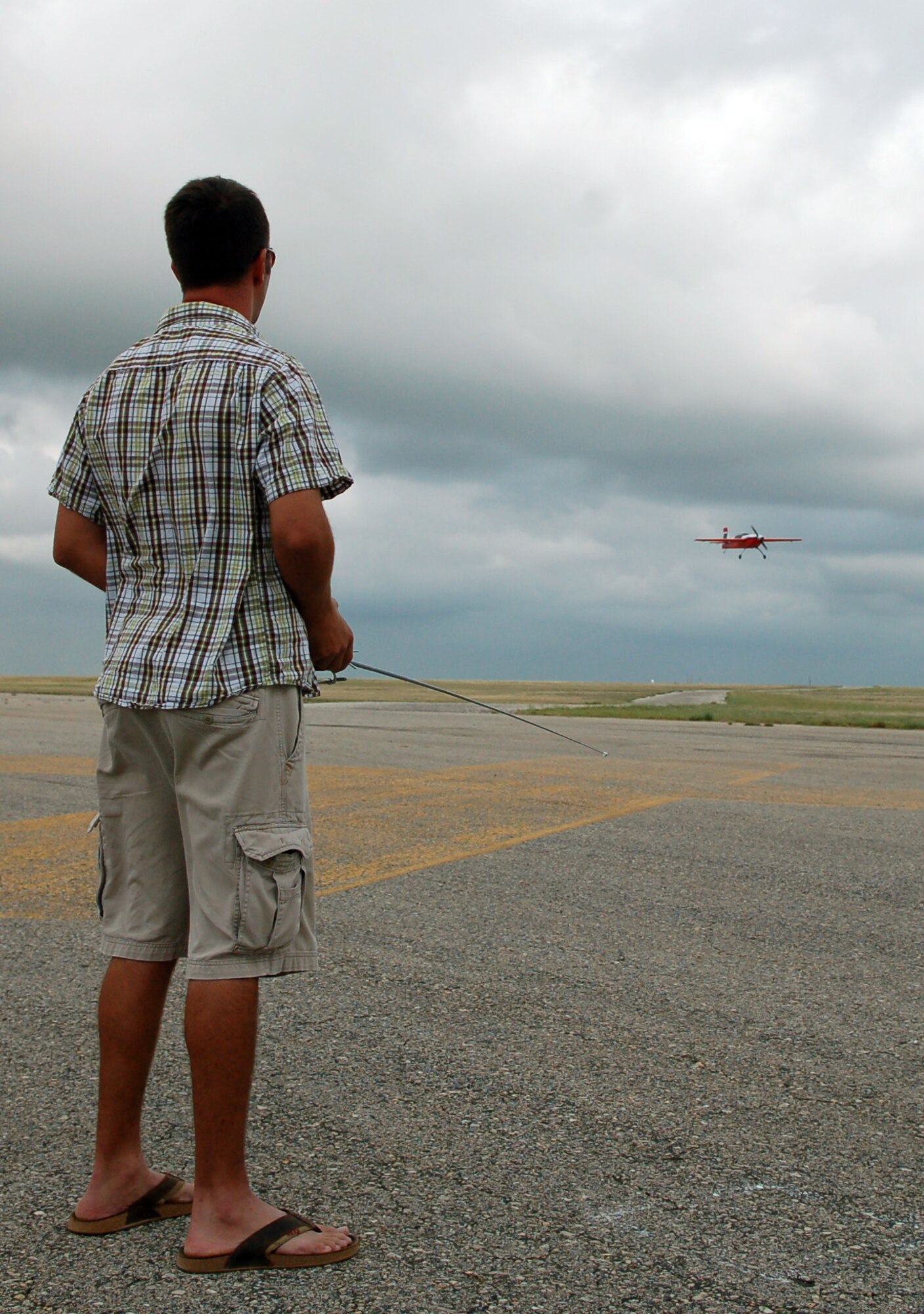LAUGHLIN AIR FORCE BASE, Texas – First Lt. Nick Burik, 85th Flying Training Squadron, flies his award-winning Extra 300.  The aircraft has a ten-foot wingspan and can fly at approximately 120 mph.  Lieutenant Burik is a member of the Del Rio Dirt Flyers, a small group of radio-control aviation enthusiasts who fly at Laughlin when the airfield is closed.  (U.S. Air Force photo by Staff Sgt. Austin M. May)