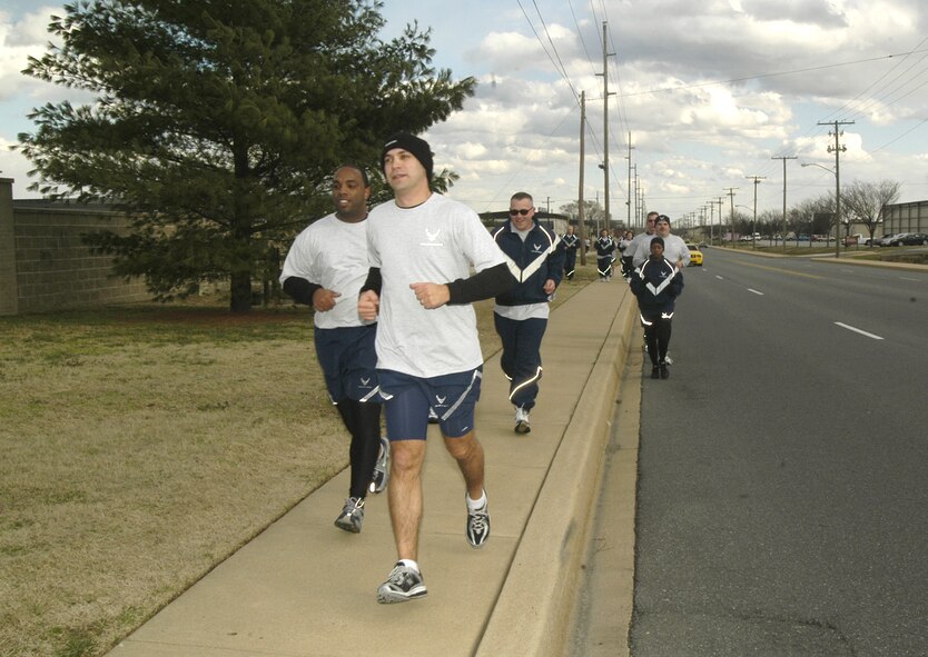 More than one hundred Airmen from Dover Air Force Base ran approximately three miles here Tuesday at the Wing Warrior Run. The runs are held monthly to build morale and emphasize fitness as a core component to fostering a warrior mentality among Airmen. (U.S. Air Force photo/Master Sgt. Melissa Phillips) 