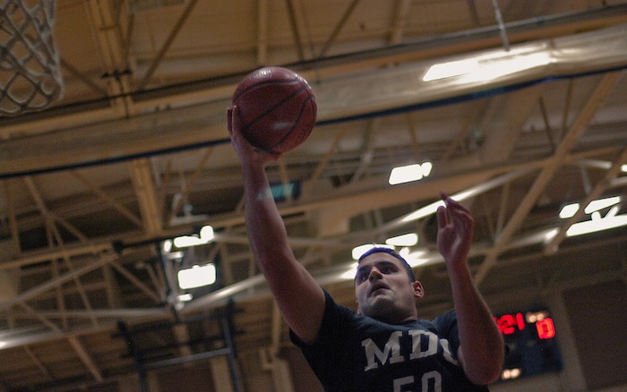 Medical Group player Justin Steidler, lays the ball up for 2 points during an intramural basketball game Feb. 19 at the Fitness and Sports Center. The Medical Group grounded the Flyers 61-27. (U.S. Air Force photo/Senior Airman Nicholas Pilch
