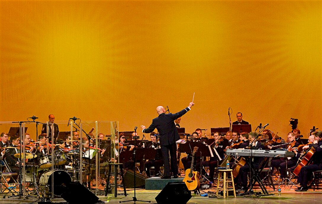 Members of the country music band Restless Heart perform with the U.S. Air Force Band during a performance at the Daughters of the American Revolution Constitution Hall in Washington, D.C., Feb. 10. The Band performed with the country music legend Restless Heart as part of its 2008 Guest Artist Series, which runs through March 2. (Courtesy David Litvin)