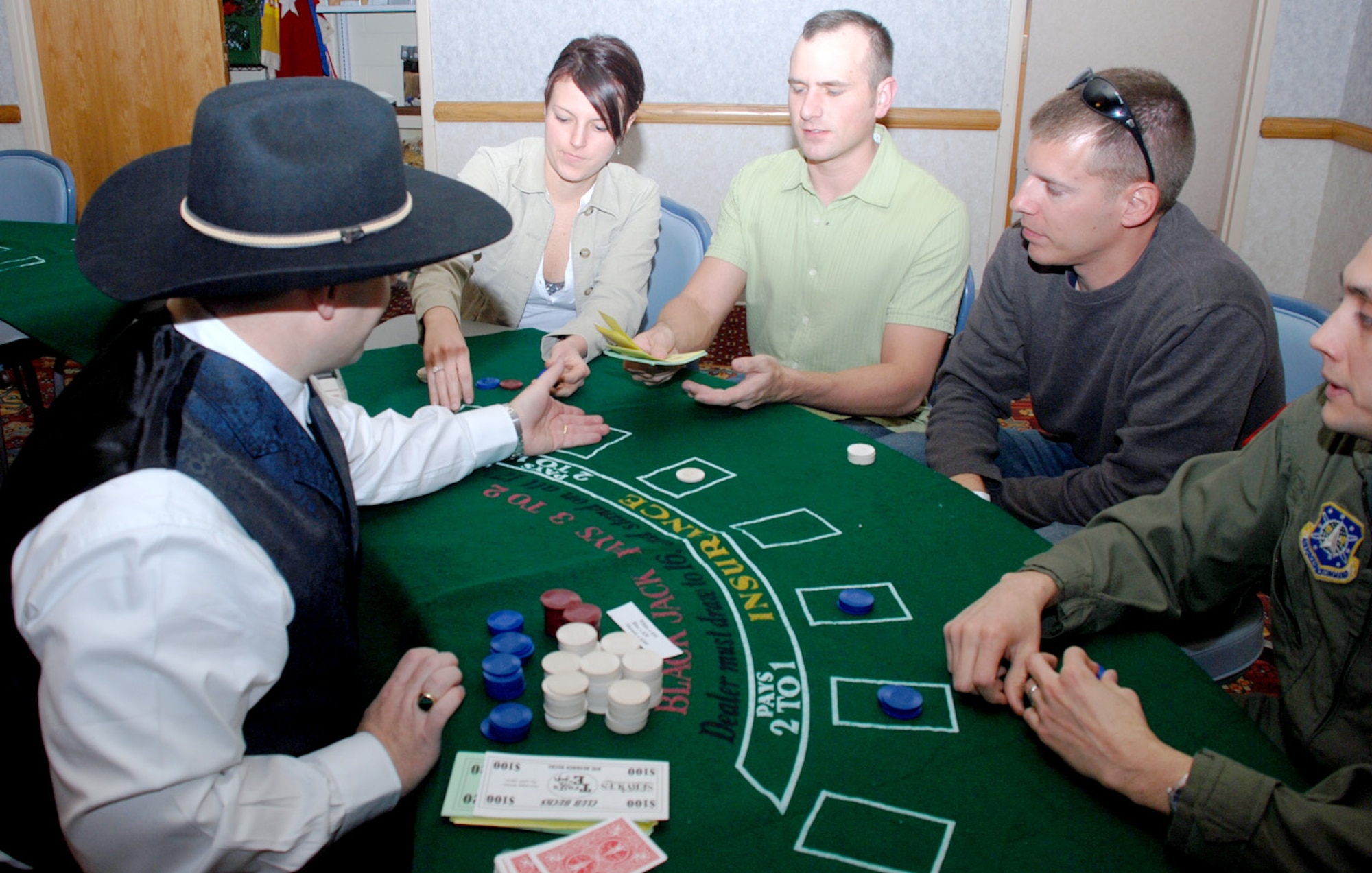 Participants of the party play a game at Casino Night Feb. 8. The chips were used as fake money.