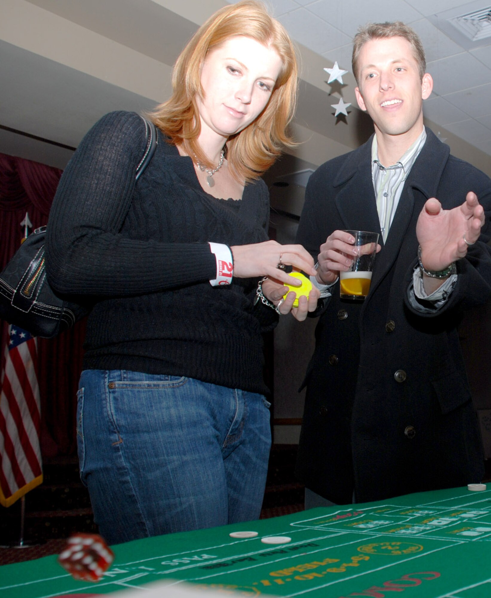 Capt. Jason Richter, 90th Medical Support Squadron, and his wife, Chrissy, participate in a game of craps.