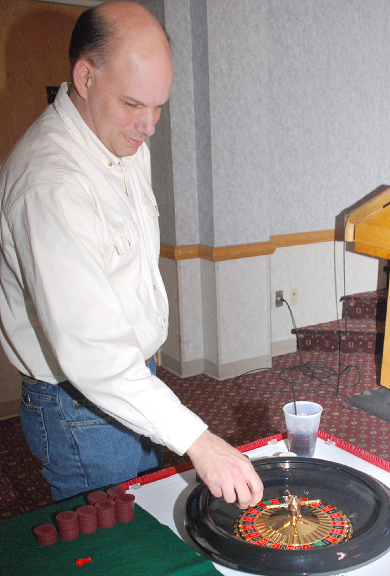 Capt. Andrew Mercer, 90th Operations Support Squadron, plays a game of roulette at the Casino Night in the Trail’s End Club Feb. 8. The Company Grade Officer Council sponsored the event which had more than 50 Warren members attend. Participants of the party used fake money to earn the grand prize: a gaming console (U.S. Air Force photos/2nd Lt. Lisa Meiman).