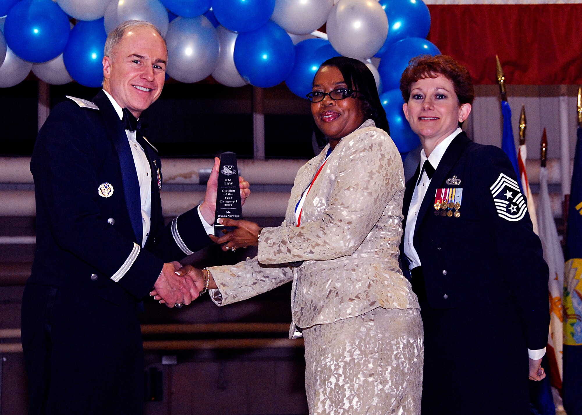 Brig. Gen. Richard Devereaux, 82nd Training Wing commander, presents Wanda Norwood, 82nd Medical Group, with the Civilian of the Year award, category I, Feb. 8 at the 82nd TRW Annual Awards Banquet. (U.S. Air Force photo/Harry Tonemah)