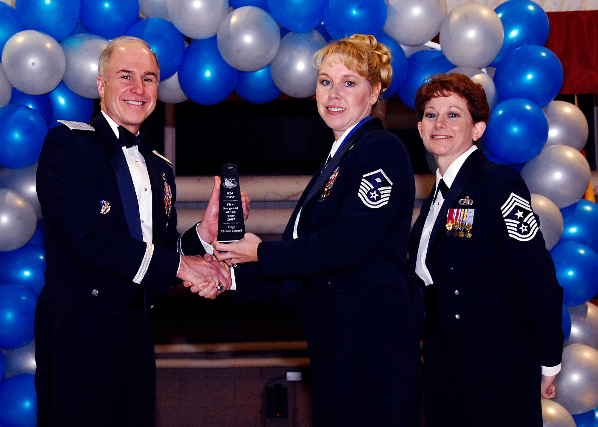 Brig. Gen. Richard Devereaux, 82nd Training Wing commander, presents Master Sgt. Christie Lingard, 782nd Training Group, with the First Sergeant of the Year award Feb. 8 at the 82nd TRW Annual Awards Banquet. (U.S. Air Force photo/Harry Tonemah)