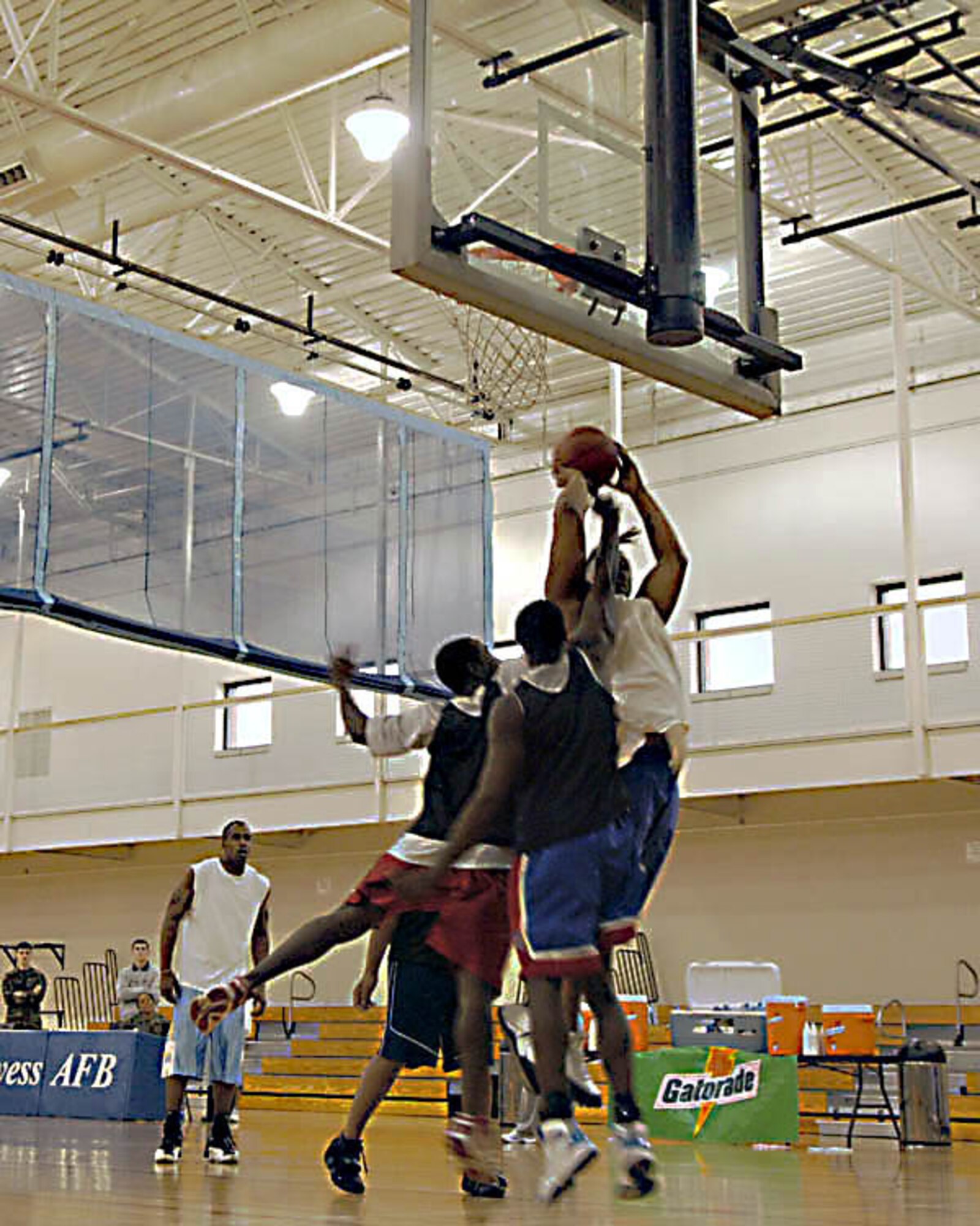 DYESS AIR FORCE BASE, Texas -- Two teams battle during the Love and Basketball Tournament Feb. 15 at the base gym. The tournament is one of the many events planned by the Black Heritage Committee for the month of February. (U.S. Air Force photo by Staff Sgt. Conner Estes)