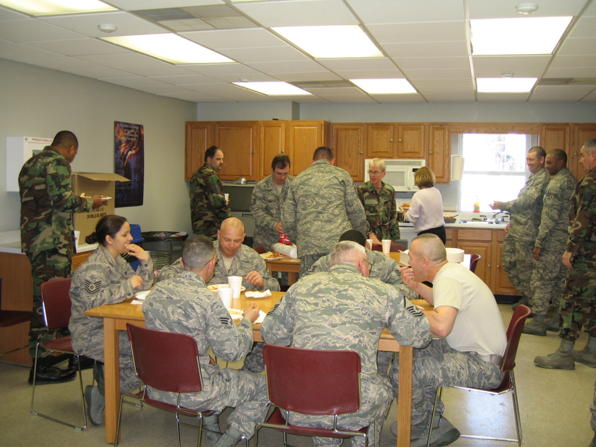 SEYMOUR JOHNSON AIR FORCE BASE, N.C. -- 916th Civil Engineers know how to throw a going-away party. Senior Master Sgt. Mark Stolar (sitting down far right) prepares to leave for a year deployment to Afghanistan. The Reservist is a structures shop superintendent with the Reserve wing. His fellow reservists threw a in-house luncheon for him prior to deploying.