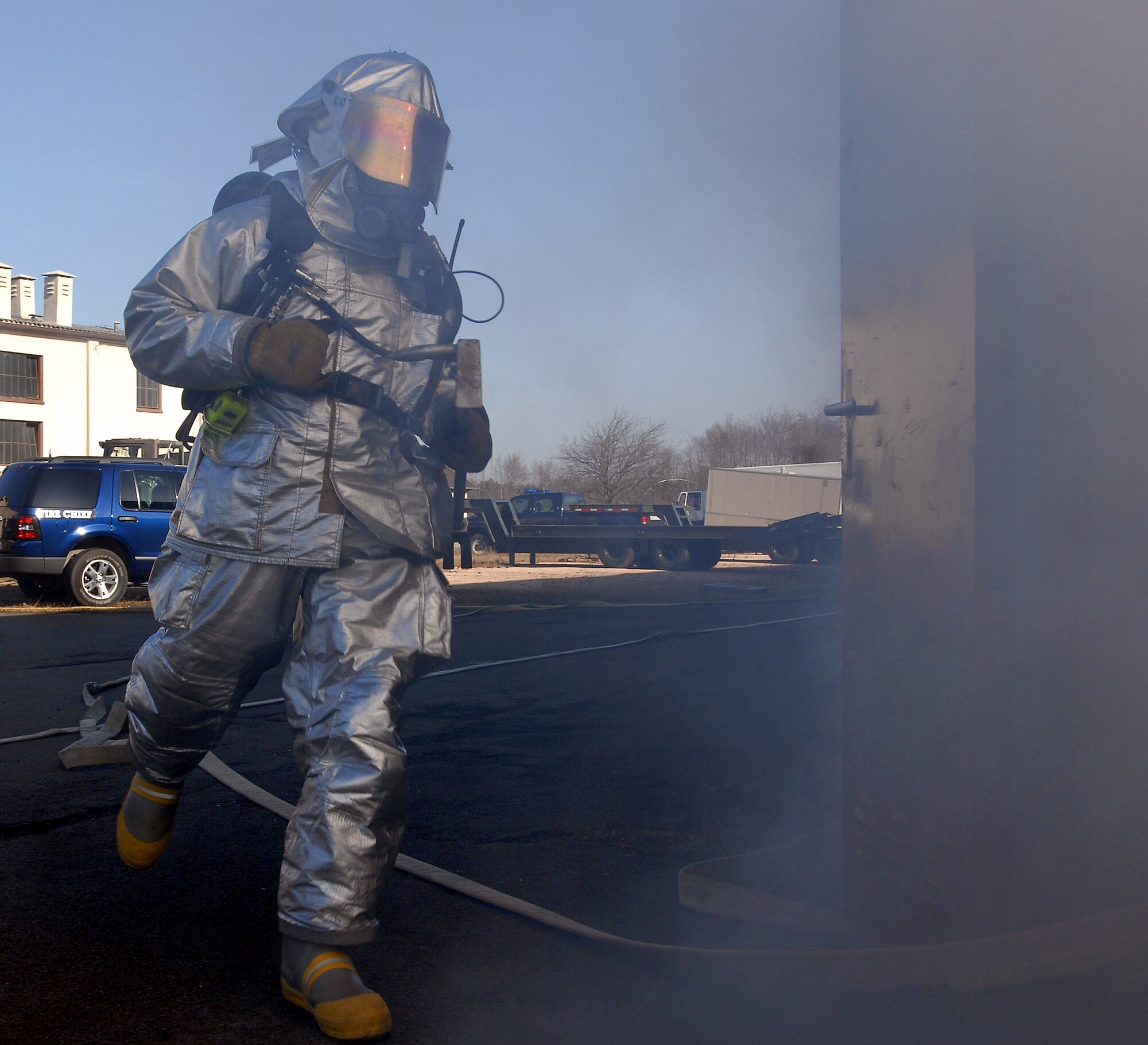 A firefighter participates in a mass casualty exercise Feb. 11 at Ramstein Air Base, Germany. The scenario involved 23 firefighters working to save victims trapped in a burning building. (U.S. Air Force photo/Airman 1st Class Kenny Holston)