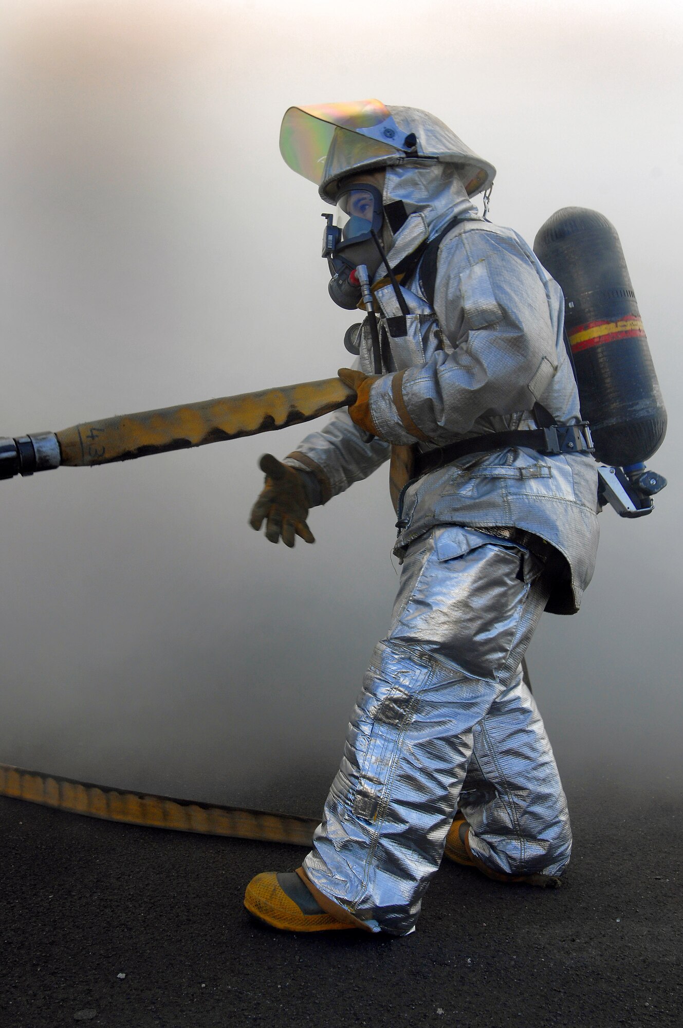 A firefighter participates in a mass casualty exercise Feb. 11 at Ramstein Air Base, Germany. The scenario involved 23 firefighters working to save victims trapped in a burning building. (U.S. Air Force photo/Airman 1st Class Kenny Holston)
