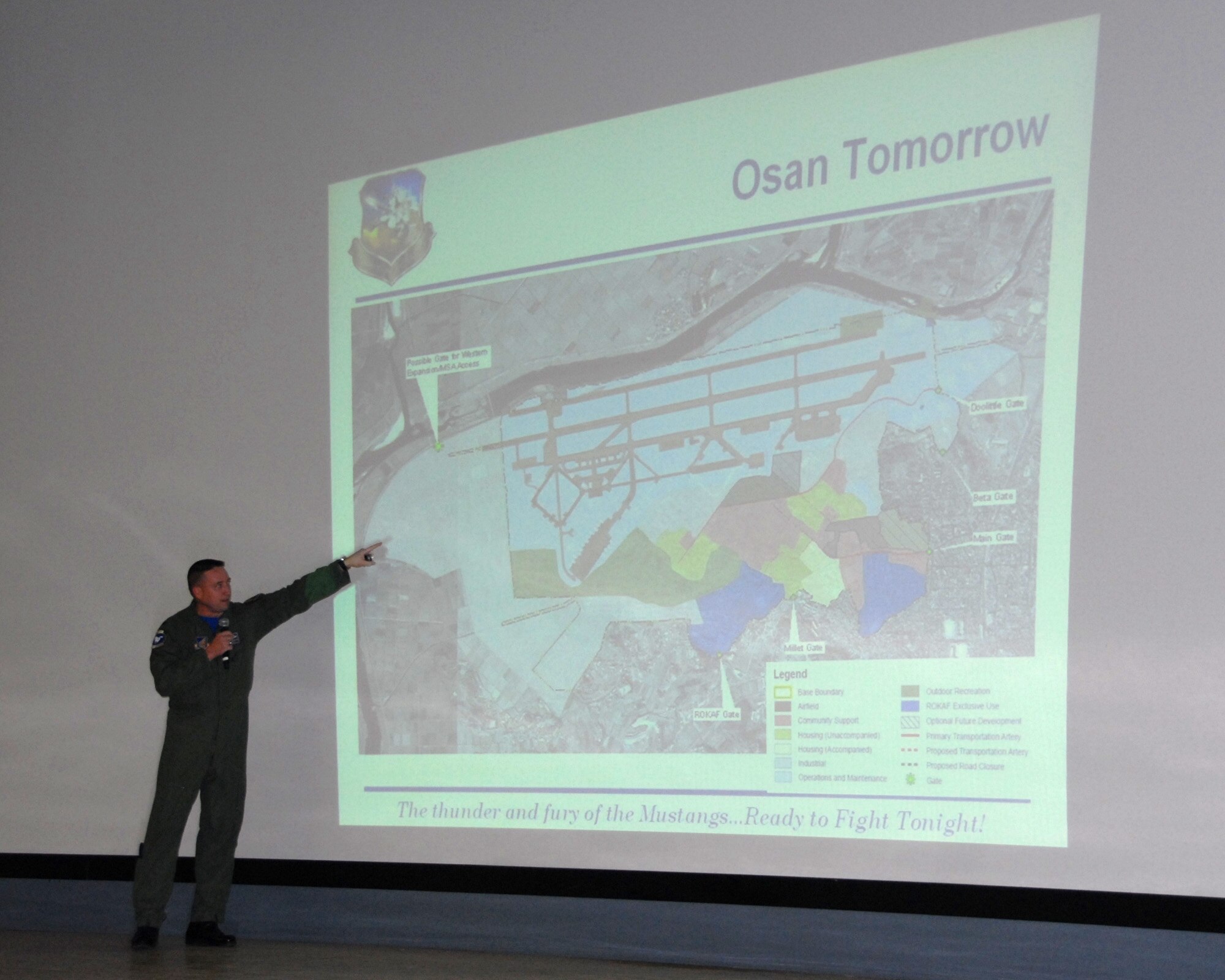 OSAN AIR BASE, Republic of Korea -- Col. Jon Norman, 51st Fighter Wing commander, explains future installation construction and improvement projects for Osan Air Base during a Town Hall meeting with base residents at the base theater Feb. 15.  (U.S. Air Force photo/Senior Master Sgt. Marvin Krause)