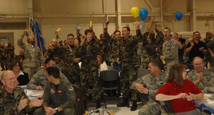 LANGLEY AIR FORCE BASE, Va. – Members of the 1st Maintenance Operations Squadron cheer after winning the 2007 Maintenance Professional of the Year Unit Esprit De Corps trophy during the Maintenance Professional of the Year banquet Feb. 8. This trophy is awarded to the squadron that exemplified morale and used to teamwork to accomplish the mission. (U.S. Air Force photo/Senior Airman Cecil C. McCloud)