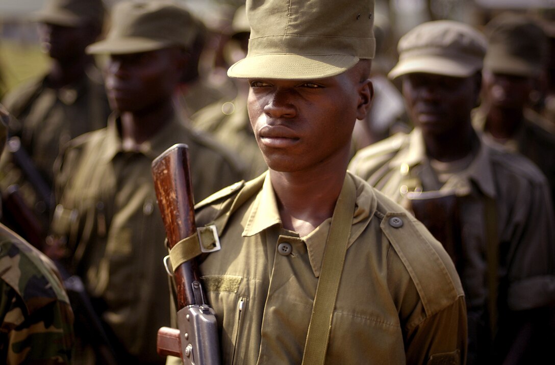 Ugandan army soldiers stand in formation before being released for the day after completing part of a land navigation course taught by U.S. soldiers on Forward Operating Location Kasenyi, Uganda, Feb. 12, 2008. 