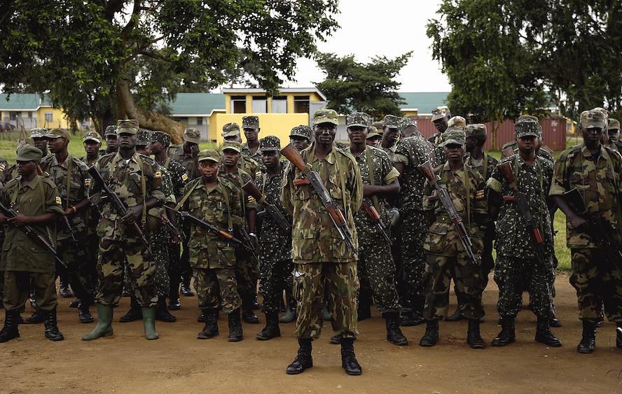 Ugandan army soldiers stand in formation as they prepare to receive ...