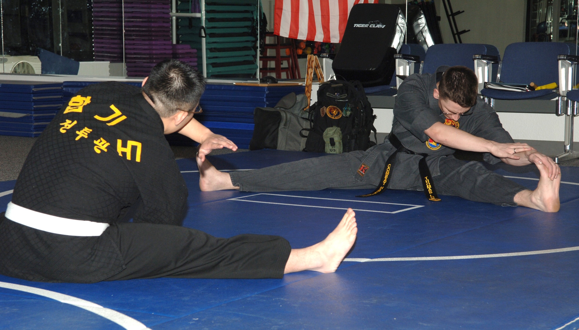 FAIRCHILD AIR FORCE BASE, Wash. -- Staff Sergeant Thomas Locke, begins his Combat Hapkido class with stretches at the base Fitness Center on Feb. 5. Sergeant Locke has been studying Combat Hapkido for five years, but has studied several other martial arts for more than twelve. The Combat Hapkido class, which teaches self defense, is offered Tuesdays and Thursdays from 6 to 8 p.m. at the Fitness Center. (U.S. Air Force photo / Senior Airman Jocelyn Ford)