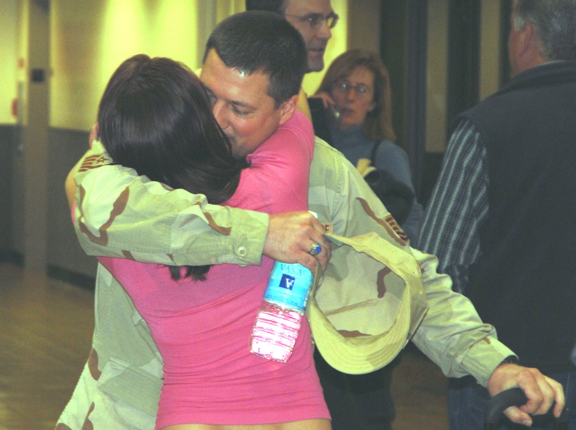 Technical Sgt. Dennis D. Beesley, an Air Force Reservist, gets a welcoming hug from family waiting for him at Sacramento International Airport Feb. 18, 2008. He was mobilized for a six month deployment to the 376th Air Expeditionary Wing at Manas Air Base, in the former Soviet republic of Kyrgyzstan in Central Asia. He is assigned to the 940th Logistics Readiness Squadron, Beale Air Force Base, Calif., as a transportation specialist. (U.S. Air Force photo/Master Sgt. Ellen L. Hatfield)