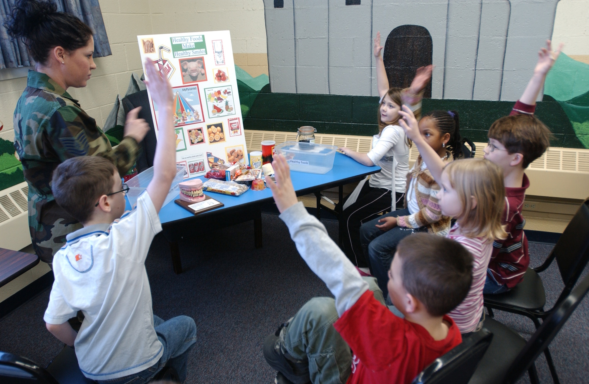 EIELSON AIR FORCE BASE, Alaska --Tech. Sergeant Jennifer Dreier, 354th Medical Group dental technician, asks students of Anderson Elementary if they know why it is important to brush your teeth after eating Feb. 20, 2008, at the school. With February being National Dental Health Month, Icemen of the 354th Medical Group dental office do their part by visiting students of Anderson Elementary to share knowledge on how to maintain their bright smiles. (U.S. Air Force photo by Airman 1st Class Christopher Griffin) 