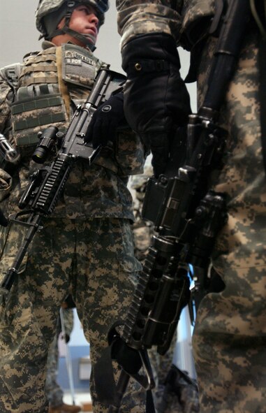 Members of a combat team from the Army's First Stryker Brigade at Fort Wainwright, Alaska, prepare for their departure from the Joint Mobility Center at Eielson Air Force Base, Alaska, to South Korea in support of a Foal Eagle exercise.  The Soldiers will be transported to the exercise by aircrews from the 517th Airlift Squadron at Elmendorf AFB, Alaska, in C-17 Globemaster IIIs.  (U.S. Air Force photo/Staff Sgt. Eric T. Sheler)