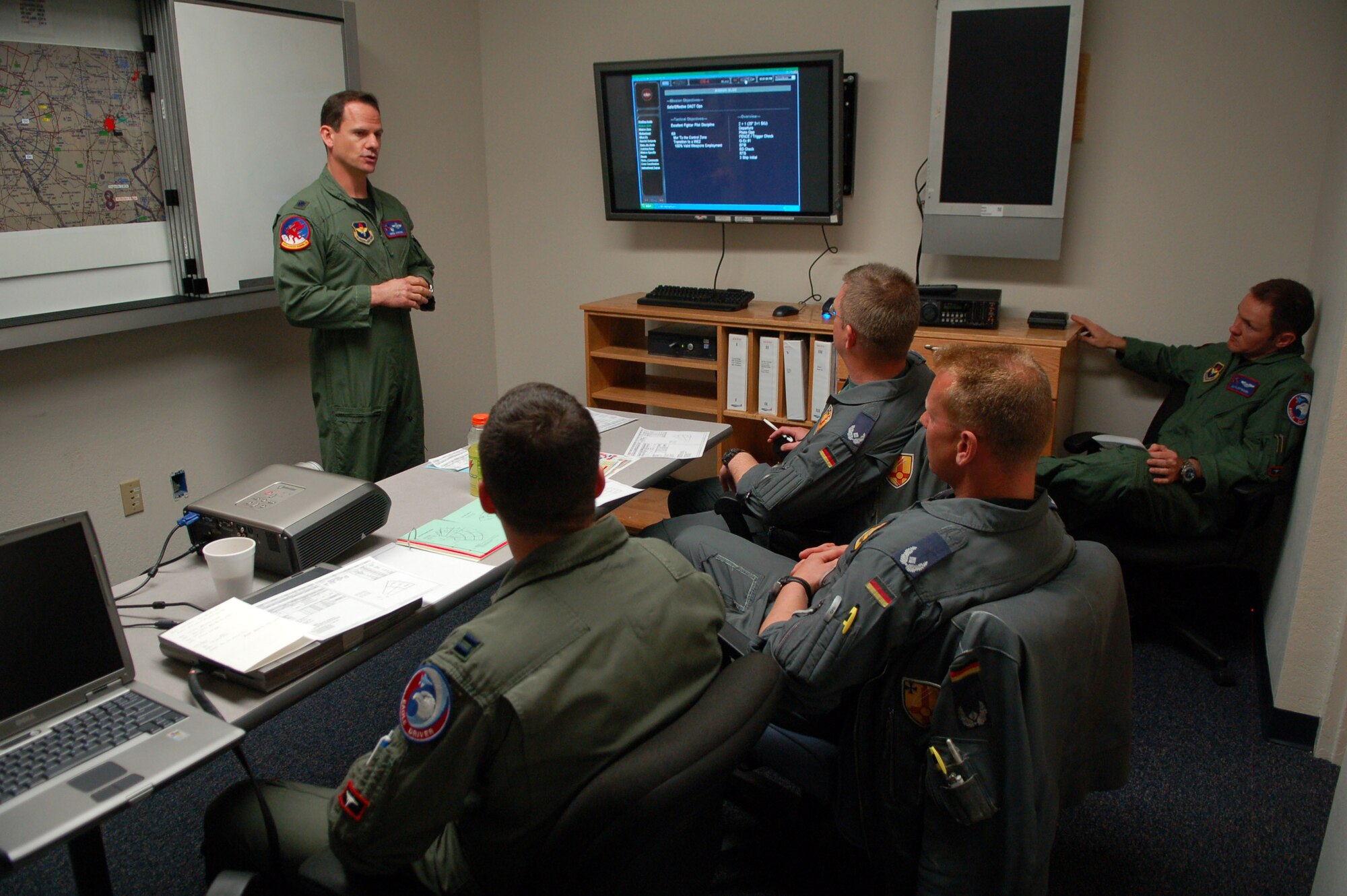 LAUGHLIN AIR FORCE BASE, Texas – Lt. Col. Gary Johnson, 434th Fighter Training Squadron, briefs German and U.S. Air Force fighter pilots prior to a training exercise here Feb. 19.  The German aircrew participated in the first-ever training program with instructor pilots from the 434th Fighter Training Squadron that included mock dogfights.    (U.S. Air Force photo by Staff Sgt. Austin M. May)