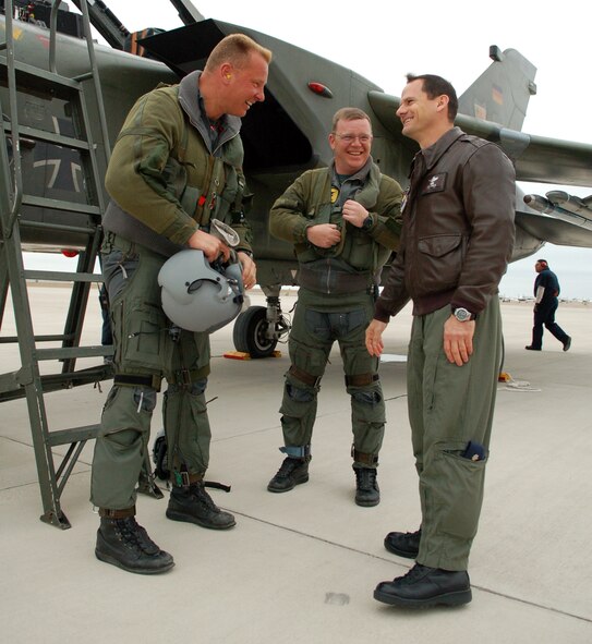 LAUGHLIN AIR FORCE BASE, Texas – Lt. Col. Gary Johnson, 434th Fighter Training Squadron, greets German air force Majors Axel Hoppe and Andreas Krzossa, who brought a German Tornado aircraft from Holloman Air Force Base, N.M., to Laughlin Feb. 19.  The German aircrew participated in the first-ever training program with instructor pilots from the 434th FTS that included mock dogfights.  (U.S. Air Force photo by Staff Sgt. Austin M. May)