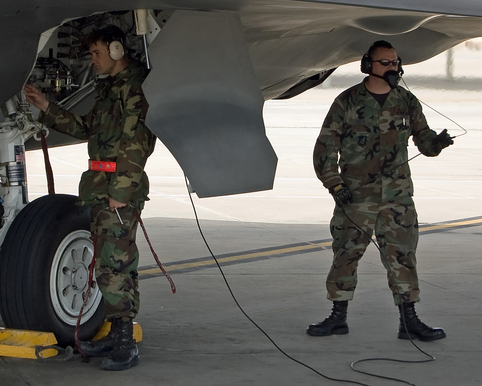 Airman 1st Class Shawn Krause and Staff Sgt. Justin Speak prepare to launch an F-22 Raptor Feb. 4 at Tyndall Air Force Base, Fla. Members of the 3rd Wing and Air Force Reserve Command's 477th Fighter Group from Elmendorf AFB, Alaska, combined for its first F-22 Raptor deployment to Tyndall AFB for Combat Archer. The 132 Reserve and active-duty Airmen and eight F-22s from Alaska were in Florida for Weapons System Evaluation Program training. Colonel Shower is the 90th Fighter Squadron commander. Airman Krause and Sergeant Speak are 90th Aircraft Maintenance Unit crew chiefs. (U.S. Air Force photo/Scott Wolfe) 
