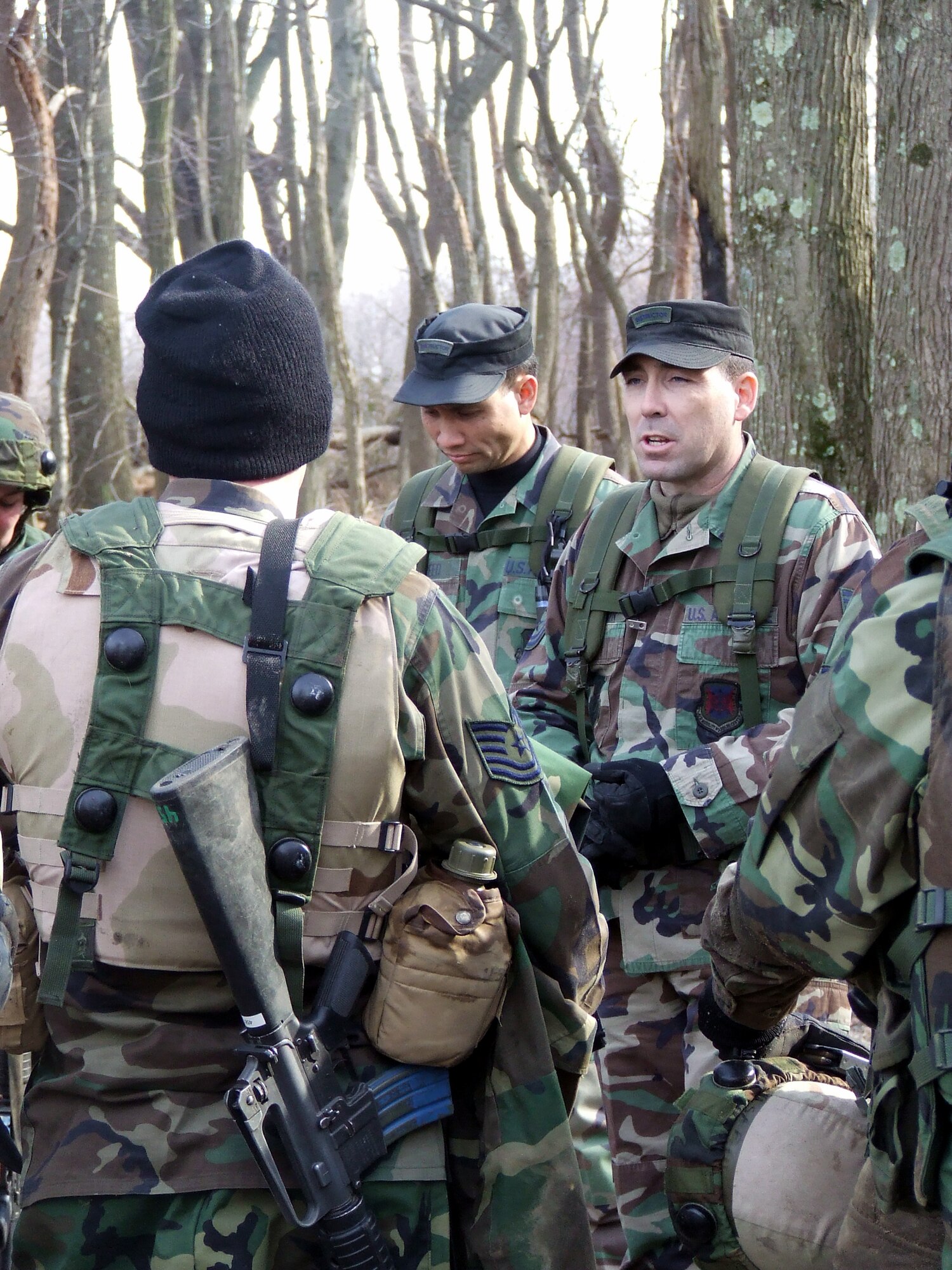 Tech. Sgt. Roy Johnson, contingency skills training instructor from the U.S. Air Force Expeditionary Center's 421st Combat Training Squadron, talks to students in the Advanced Contingency Skills Training Course 08-2A during training on a range on Fort Dix, N.J., Feb. 15, 2008.  The course prepares Airmen from multiple career fields in expeditionary combat basic skills such as convoy operations, tactics and combat first aid prior to deployment.  (U.S. Air Force Photo/Tech. Sgt. Scott T. Sturkol)
