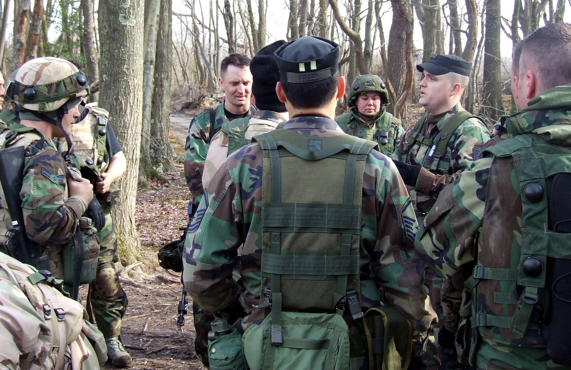 Tech. Sgt. Greg Hasecuster, contingency skills training instructor from the U.S. Air Force Expeditionary Center's 421st Combat Training Squadron, talks to students in the Advanced Contingency Skills Training Course 08-2A during training on a range on Fort Dix, N.J., Feb. 15, 2008.  The course prepares Airmen from multiple career fields in expeditionary combat basic skills such as convoy operations, tactics and combat first aid prior to deployment.  (U.S. Air Force Photo/Tech. Sgt. Scott T. Sturkol)