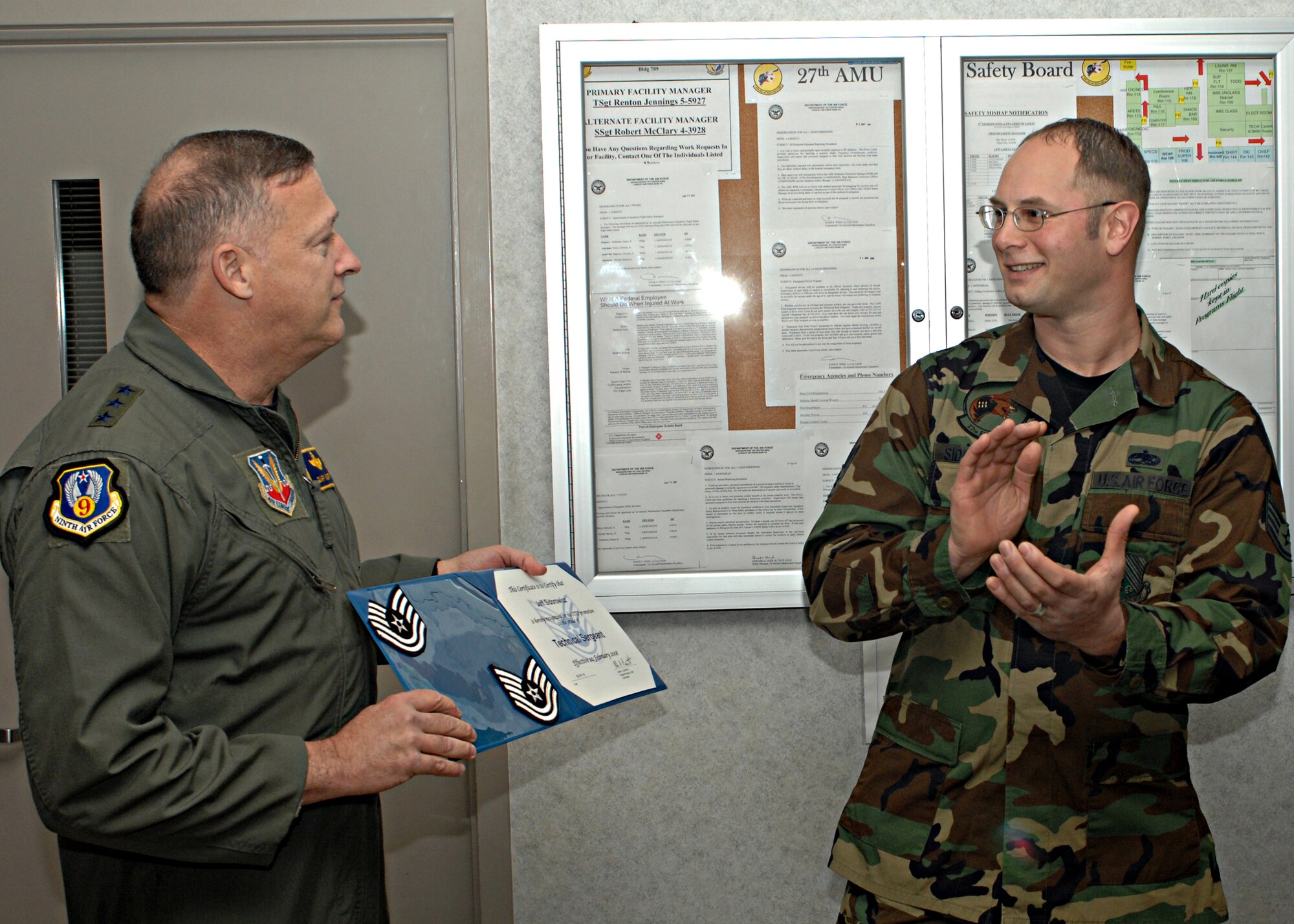 LANGLEY AIR FORCE BASE, Va -- Lt. Gen. Gary North, commander of 9th Air Force and U.S. Air Forces Central Command, presents Staff Sgt. Jeff Sidorowicz, 1st Aircraft Maintenance Squadron crew chief, with a certificate of promotion to technical sergeant Feb. 20 at the 27th Aircraft Maintenance Unit building. General North presented two promotions under the Stripes for Exceptional Performers program during his visit.. (U.S. Air Force photo/Airman 1st Class Zachary Wolf)