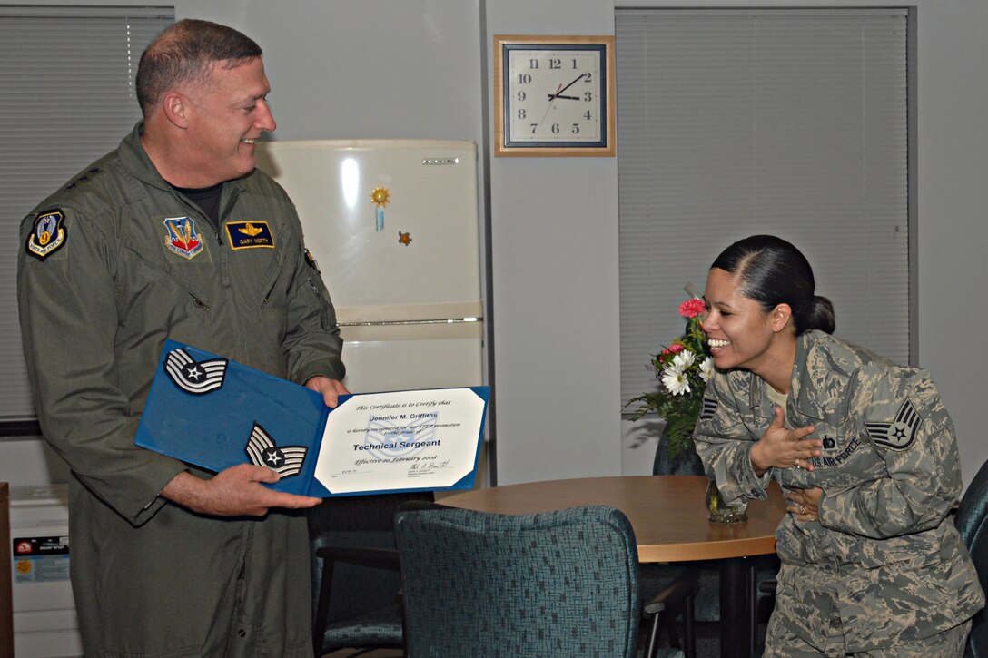 LANGLEY AIR FORCE BASE, Va -- Lt. Gen. Gary North, commander of 9th Air Force and U.S. Air Forces Central Command, presents Staff Sgt. Jennifer Griffiths, Langley Airman Leadership School instructor, with a certificate of promotion to technical sergeant Feb. 20 in Langley’s ALS conference room. General North presented two promotions under the Stripes for Exceptional Performers program during his visit. (U.S. Air Force photo/Airman 1st Class Zachary Wolf)