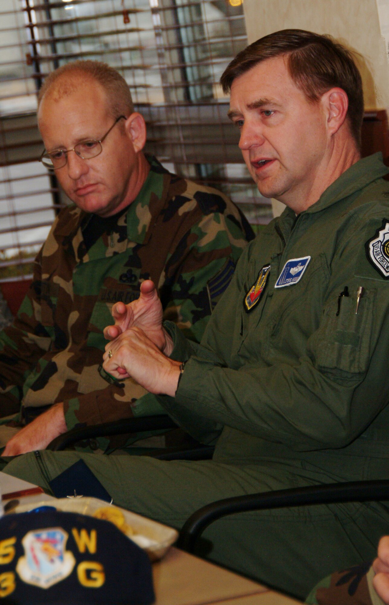 Chief Master Sgt. Douglas Martin, 53d Weapons Evaluation Group, listens in as Brig. Gen. Stephen Hoog, United States Air Force Warfare Center commander, talks with some of the 53d Wing’s enlisted members during a breakfast Feb. 21 at “The Breeze” dining facility at Eglin Air Force Base.  At the breakfast, the general spoke with the 53d Wing’s enlisted about budgetary issues, deployment, the new Air Force slogan and the future of electronic warfare.  U.S. Air Force photo by Staff Sgt. Samuel King Jr.