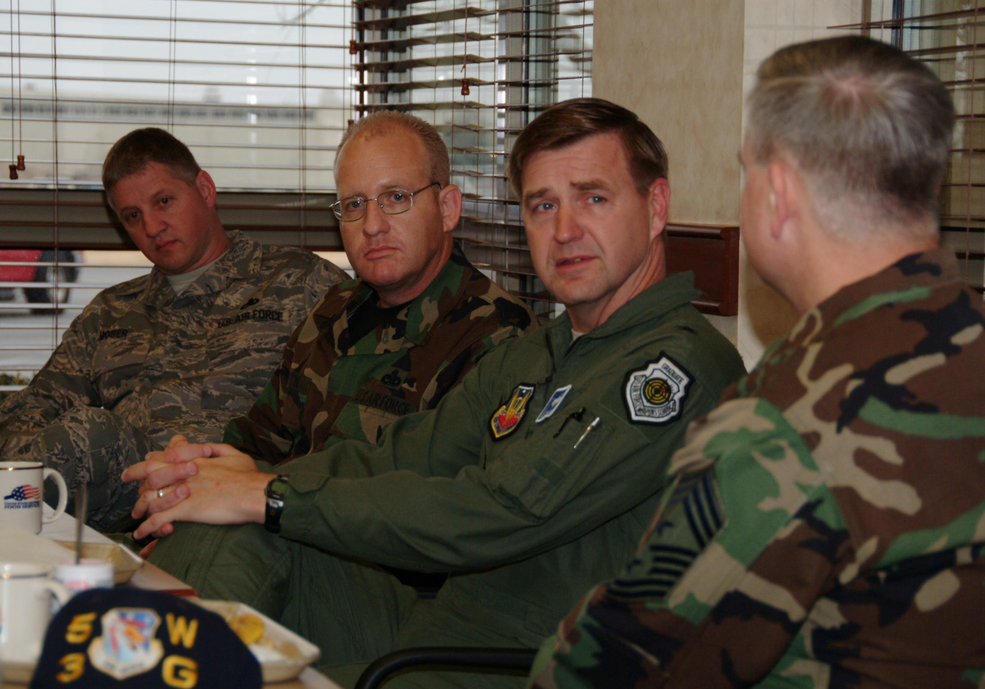 Brig. Gen. Stephen Hoog, United States Air Force Warfare Center commander, talks with Chief Master Sgt. Randy Salesfke (right), 53d Wing command chief, during the general’s breakfast with enlisted members Feb. 21 at “The Breeze” dining facility at Eglin Air Force Base.  Chief Master Sgts Neal Moser (left), 53d Electronic Warfare Group, and Douglas Martin (middle), 53d Weapons Evaluation Group, listen in.  The general spoke about budgetary issues, deployment, the new Air Force slogan and the future of electronic warfare.  U.S. Air Force photo by Staff Sgt. Samuel King Jr.
