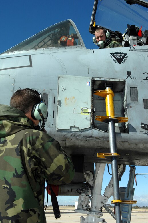 Senior Airman Brian Hunt (Cockpit) and Senior Airman James Greer, 355th Aircraft Maintenance Squadron, speak to each other before testing the engines on an A-10 Thunderbolt Feb. 5. (U.S. Air Force photo by Airman 1st Class Noah R. Johnson)