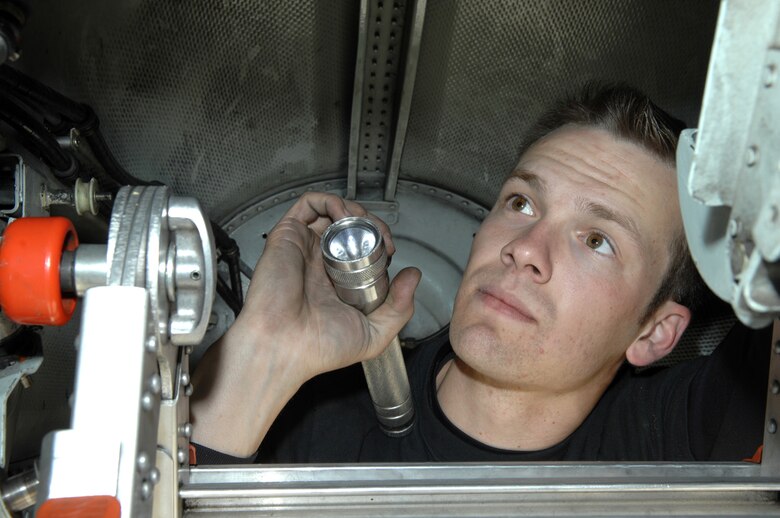 Staff Sgt. Matthew Bailey, 355th Aircraft Maintenance Squadron, works inside the fuel access panels of an A-10 Feb. 5. (U.S. Air Force photo by Airman 1st Class Noah R. Johnson)