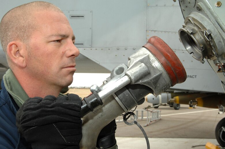 Staff Sgt. Michael Kozeniesky, 354th Aircraft Maintenance Unit crew chief, connects a fuel pump to an A-10 to fill it up with fuel Feb. 14. (U.S. Air Force photo by Airman 1st Class Noah R. Johnson)