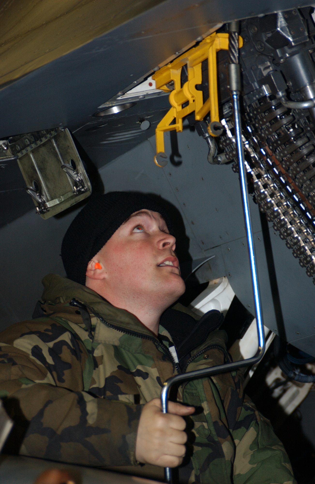 MISAWA AIR BASE, Japan -- Senior Airman Jason Barnes, 35th Aircraft Maintenance Squadron, loads 20 millimeter rounds into an F-16's gun system. The 35th Maintenance Group was awarded the PACAF Maintenance Effectiveness Award, and PACAF earned the Gen. Wilbur L. Creech Maintenance Excellence Award for 2007. (U,S, Air Force photo by Senior Airman Robert Barnett)