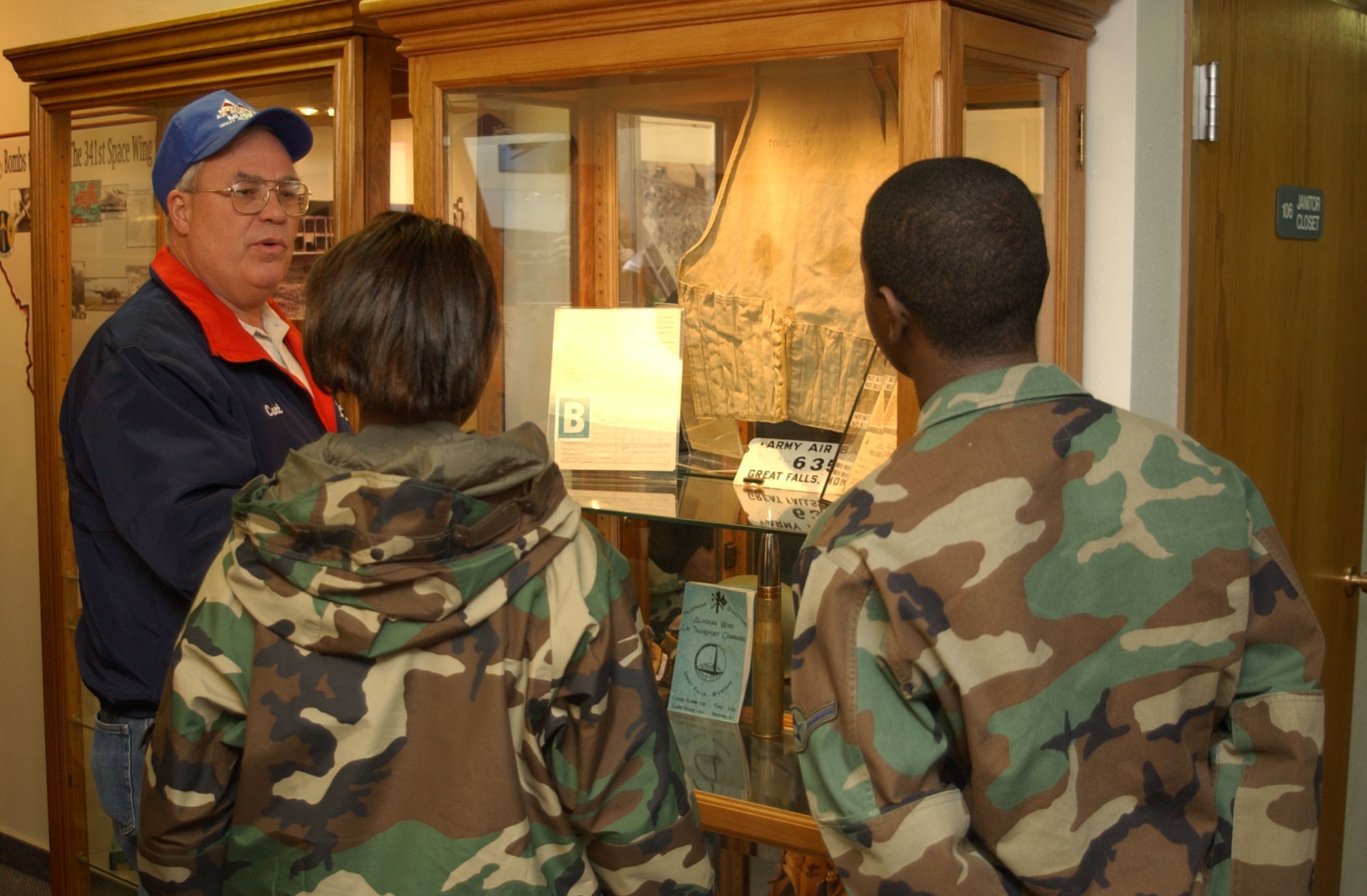 Curt Shannon, Heritage Center director, describes a museum exhibit to Airman Aaron Hollins and Airman 1st Class Lakendra Peacock, 741st Missile Security Forces Squadron members, at the Malmstrom Museum. The museum is open Monday to Friday from 10 a.m. to 4 p.m. (U.S. Air Force photo/Airman 1st Class Dillon White)