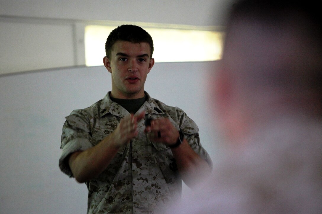 Petty Officer 3rd Class Christopher Peters, 22, from Rolla, Mo., leading instructor for the Combat Life Saver course, 1st Medical Battalion, Combat Logistics Regiment 15, 1st Marine Logistics Group, explains to students what the class is about during a CLS course aboard Camp Pendleton, Calif., Aug. 31. The 3-day course was designed to teach any Marine the basic medical skills needed to save lives in combat, when a corpsman isn’t present.
