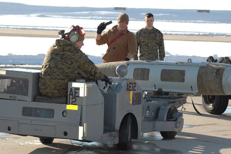 A Marine All-Weather Fighter Attack Squadron 224 ordnance crew member loads a 2,000-pound bomb onto an F/A-18 in preparation for a training mission at the Utah Test and Training Range. Hill welcomed the Beaufort, S.C. unit in January for training in the range's unique airspace and terrain. (U.S. Air Force photo by Deanna Shallenberger)